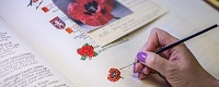 Book of someone inscribing in the Book of Remembrance