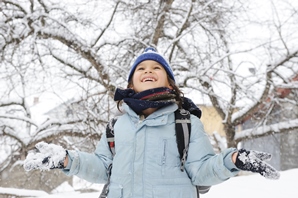 Photo of a child playing in snow