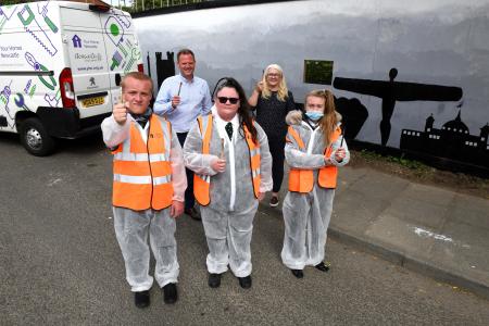 Pupils Dean Clayton, Jessica Frame and Demi-Leigh Oliver with David Langhorne, Assets and Development Director at YHN and Councillor Linda Hobson, Cabinet Member for Housing, beside the mural 