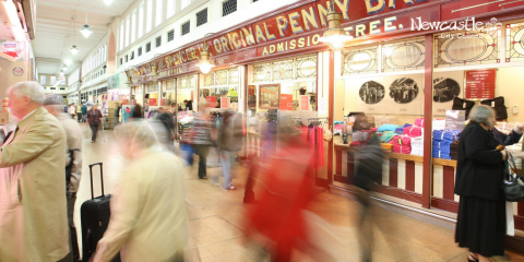 A busy Grainger Market, with shoppers visiting Marks and Spencer's stall