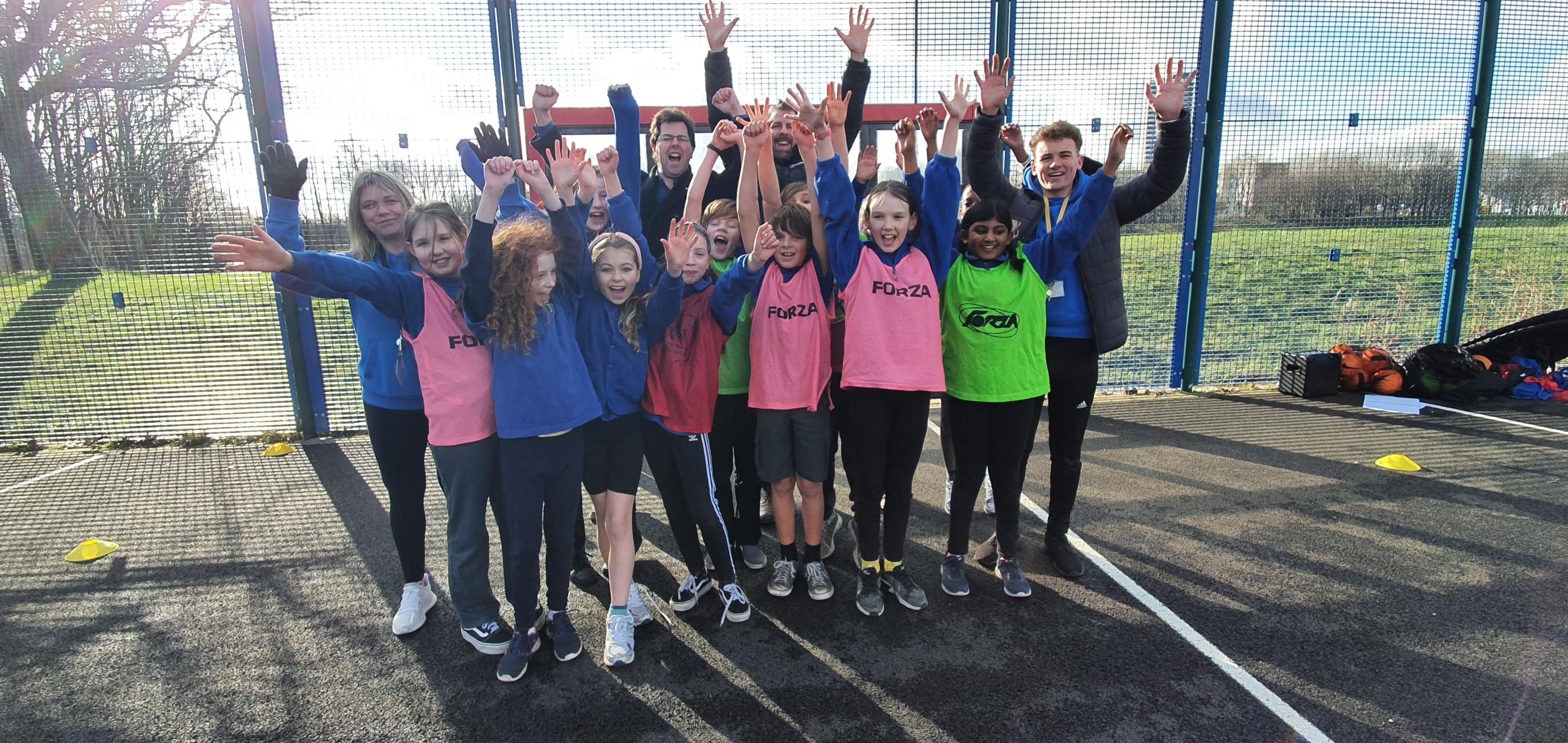 Children from Hotspur Primary test out the new interactive football wall