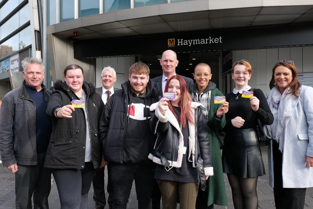 Group of people holding travel passes